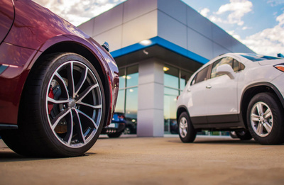 two cars outside a building