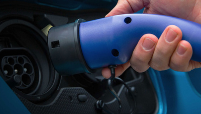 electric car being plugged in