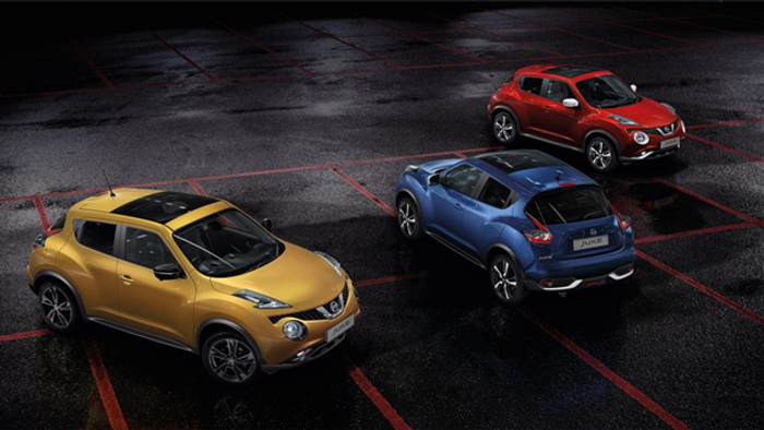 Three Nissan Juke cars parked on a wet, dark surface at night, showcasing a yellow, blue, and red model. The image highlights sleek design and vibrant colours of used cars and new cars, emphasising variety and style in compact SUVs.