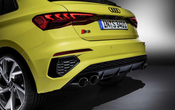 Rear view of a bright yellow Audi S3 showing distinctive taillights, quad exhaust pipes, sporty alloy wheels, and German license plate IN S 3401, highlighting a sleek design ideal for new cars or used cars market.