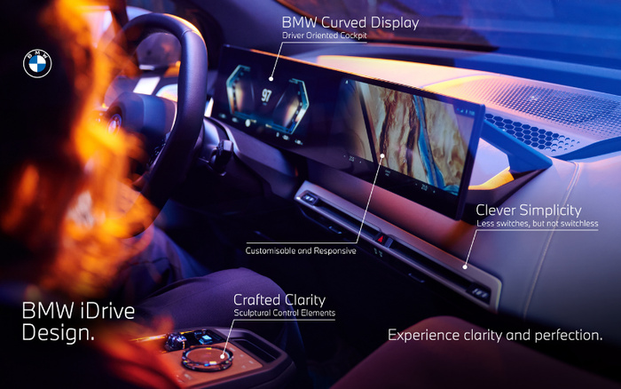 Interior view of a BMW car showcasing the BMW iDrive Design with a focus on the curved display driver-oriented cockpit, featuring customisable and responsive screens. The dashboard highlights crafted clarity with sculptural control elements and clever simplicity emphasising less switches but not switchless. The image demonstrates experience clarity and perfection, suitable for promoting used cars and new cars.