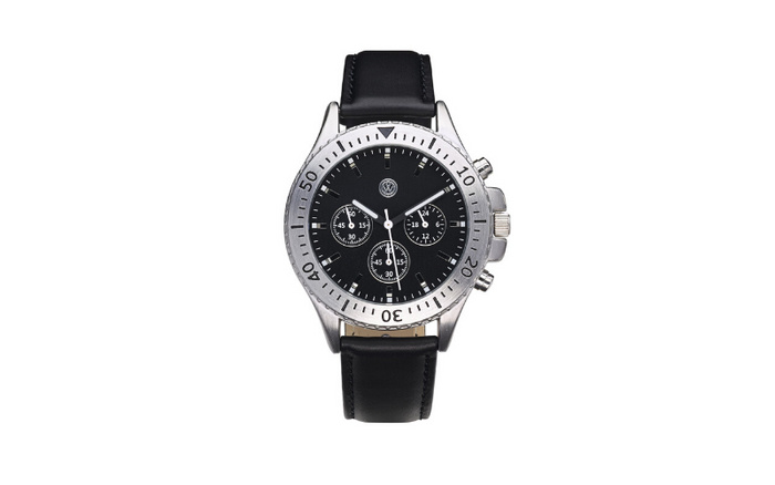 Close-up of a wristwatch with a black dial, silver bezel marked with 10 to 50 in increments of 10, and a black leather strap. The watch face features three small dials displaying seconds, hours, and minutes, with silver hour markers and hands. The image is isolated on a white background, with no reference to used cars or new cars.