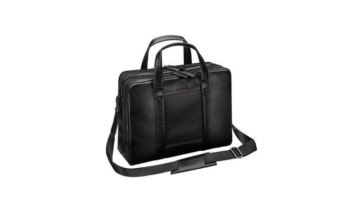 Black leather shoulder bag featuring embossed 'Porsche Design' logo on front, with dual handles and detachable strap, designed for carrying essentials, ideal for customers interested in used cars and new cars.