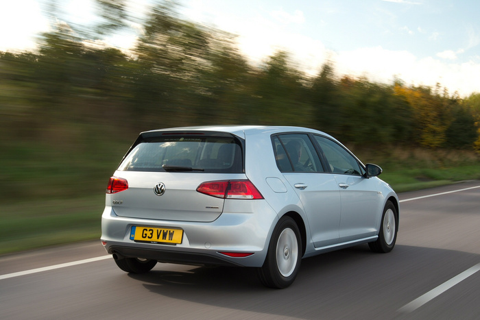 Silver Volkswagen Golf 2.0 TDI hatchback car with licence plate G3 VWW driving on a motorway with blurred green trees in the background, showcasing a popular model for both used cars and new cars options in the UK.
