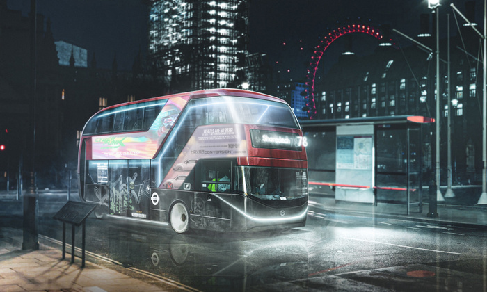 Futuristic London double-decker bus at night with glowing white LED lights outlining its edges, graffiti on its lower side, and a digital route display showing 'Shoreditch 178'. The bus features advertisements including a neon-style 'CYBERPUNK' graphic and an ad reading 'WHEELS ARE SO 2076! NOT UN HOVER CONVERSION.' The scene includes a London Eye illuminated in red in the background and a bus stop nearby. Reflective wet road surface enhances the futuristic atmosphere. Keywords: used cars, new cars.