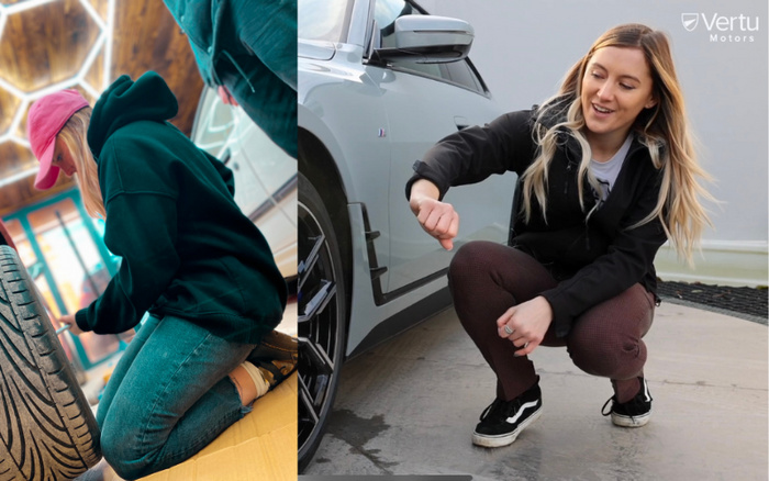 Two images side by side; left shows a person wearing a pink cap, black hoodie, and jeans kneeling indoors on the floor inspecting a car tyre. Right shows a woman with long blonde hair, dressed in a black jacket and brown pants, squatting outdoors next to a silver car's black alloy wheel, smiling and gesturing with her fist. The top right corner has the Vertu Motors logo. This image relates to used cars and new cars offered by Vertu Motors.