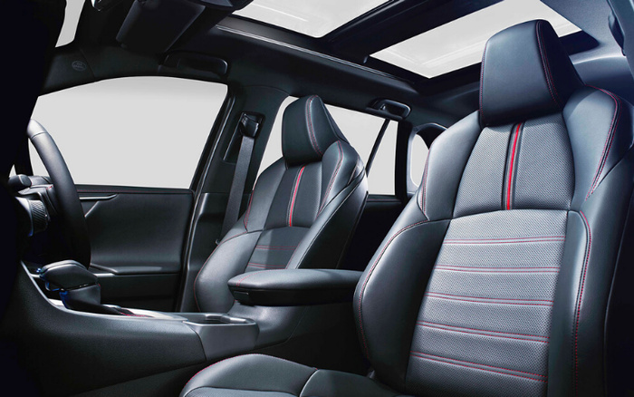 Interior view of a modern car showing black leather seats with red stitching, a centre console, steering wheel, and panoramic sunroof, highlighting the premium design and comfort features suitable for used cars and new cars.