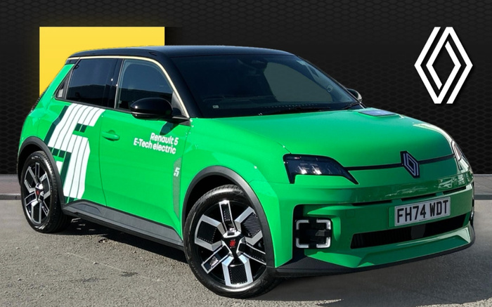 Bright green Renault 5 E-Tech electric car parked on a grey surface with a black and yellow backdrop featuring the Renault logo in white. The car has a black roof, black side mirrors, and distinctive modern alloy wheels. Text on the car's side reads 'Renault 5 E-Tech electric'. The front license plate displays 'FH74 WDT'. This image is suitable for advertising used cars and new cars, highlighting the Renault electric vehicle.