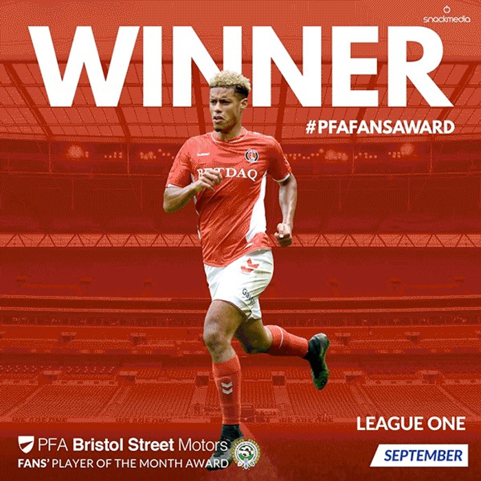Winner of the PFA Fans' Player of the Month Award for League One in September, sponsored by Bristol Street Motors, a dealership known for used cars and new cars. The image features a footballer in a red and white kit running on a stadium background, with bold white text stating 'WINNER' and the hashtag #PFAFANSAWARD.