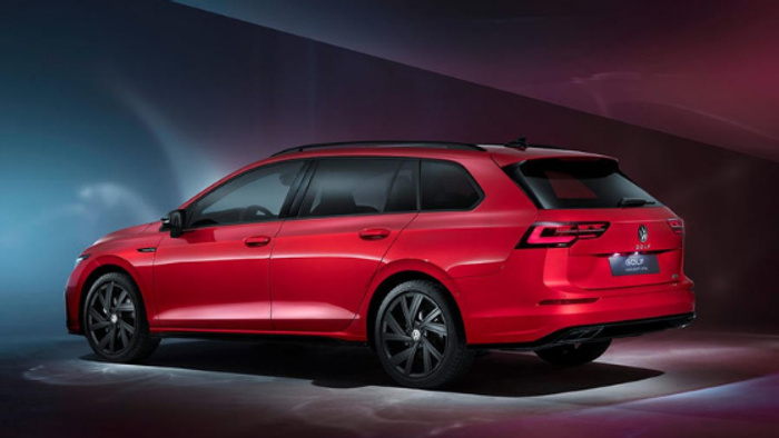 Red Volkswagen Golf Variant estate car shown in a professional studio setting with dark gradient background, highlighting the sleek design and black alloy wheels, ideal for customers browsing used cars and new cars.