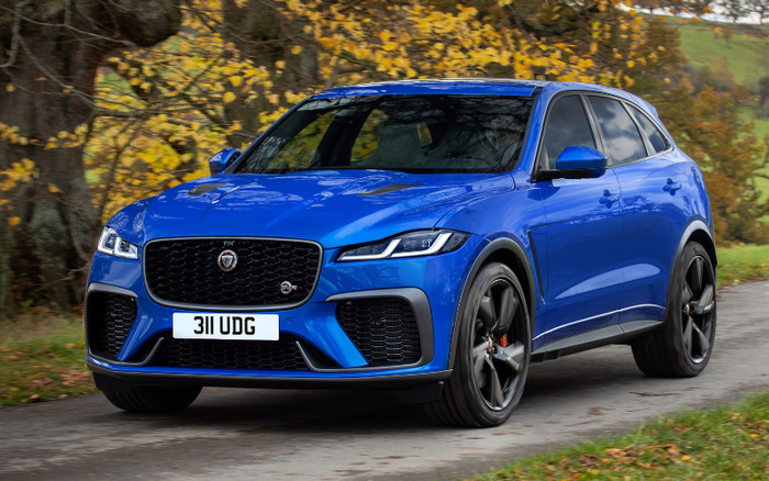Blue Jaguar F-Pace SVR sports SUV with registration plate 311 UDG parked on a country road with autumn trees in the background, showcasing a sleek design ideal for used cars and new cars shoppers.