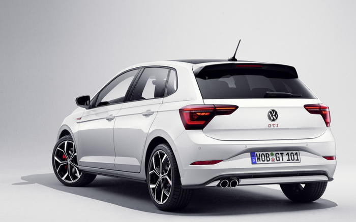 White Volkswagen Polo GTI hatchback car viewed from the rear left side against a plain white background, featuring sporty alloy wheels, dual exhaust pipes, and a license plate reading WOB GT 101, suitable for advertisements related to used cars and new cars.