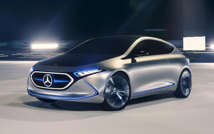 Sleek silver Mercedes-Benz electric car concept with illuminated blue accents on grille, headlights, and lower edges, shown on a modern road at night. This futuristic new car represents advanced automotive technology, ideal for customers interested in new cars or used cars with cutting-edge design features.