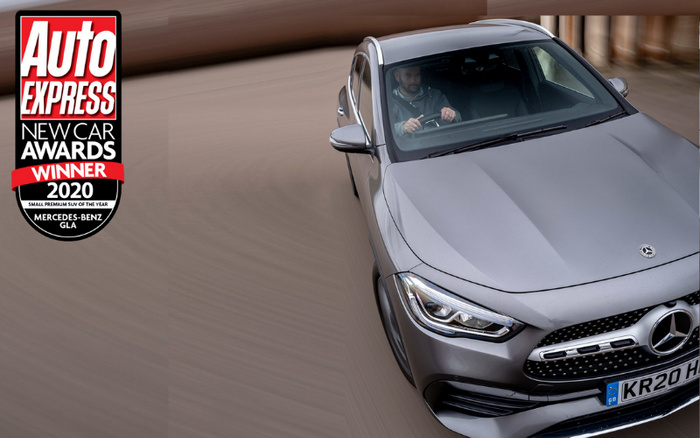 Silver Mercedes-Benz GLA driving on a curved road with a driver visible inside, UK licence plate KR20 H. On the left, a badge from Auto Express New Car Awards stating winner of 2020 Small Premium SUV of the Year. The image relates to both used cars and new cars, highlighting the award-winning model.