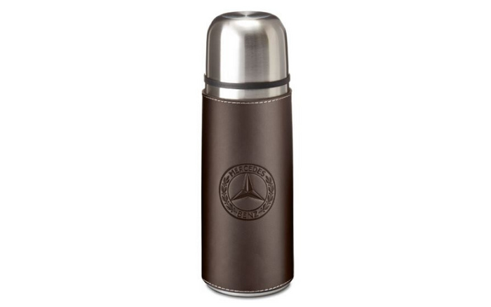 Stainless steel thermos flask wrapped in dark brown leather featuring the embossed Mercedes-Benz logo, isolated on a white background, suitable for promotional use related to used cars and new cars from Mercedes-Benz.