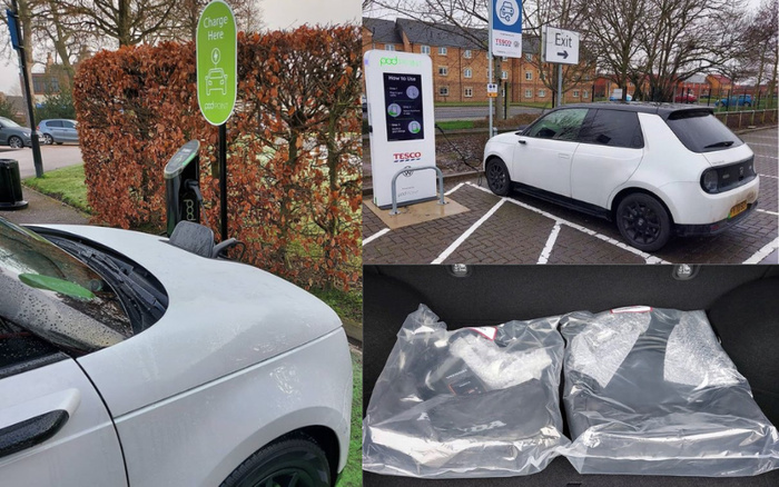 Composite image showing a white electric car charging at a Pod Point electric vehicle charger in a Tesco car park, with clear signage including 'Charge Here' and 'How to Use'. The car is parked in a designated charging bay with an exit sign visible. Another photo shows two wrapped Honda accessories or parts placed in the car's trunk. The setting includes residential buildings and leafless trees, emphasizing an eco-friendly car charging station. Keywords related to used cars and new cars are relevant as the car and accessories might be featured in a dealership or resale context.
