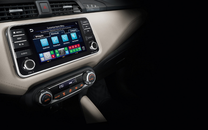 Close-up of a car dashboard featuring a touchscreen infotainment system displaying the 'Customise Home Menu' with options like Widgets, Shortcuts, and Category. The screen shows icons for Quick Dial, Phone Book, Call History, and Print Device. Surrounding buttons include MENU, MAP, AUDIO, and a volume knob on the left, with controls for camera, seek, tune, and setup on the right. Below is the climate control panel set to 23°C with Auto mode, A/C, and heated seat buttons illuminated. Beige and black interior with a modern design, suitable for showcasing features in used cars and new cars.