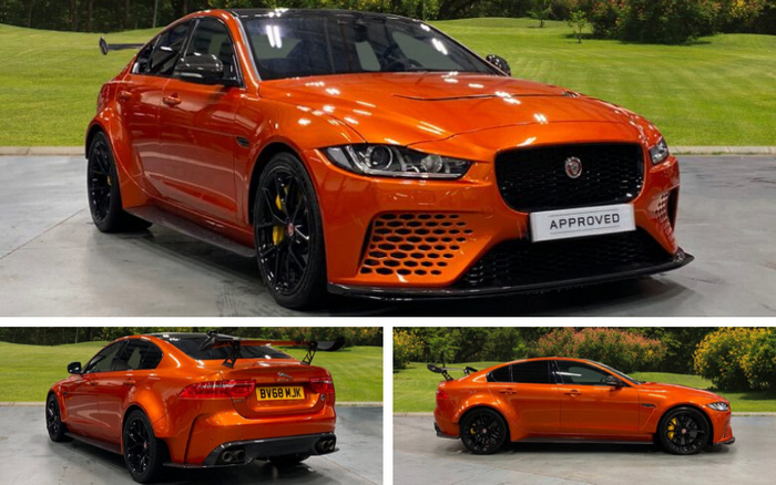 Bright orange Jaguar sports sedan with black alloy wheels and yellow brake calipers, displayed in a showroom and outdoors on a paved area with grass and trees in the background. Front view shows sleek headlights and grille with a white license plate reading 'APPROVED'. Rear and side views highlight a large rear wing, quad exhaust pipes, and a yellow license plate 'BV68 WJK'. Ideal for prospective buyers of used cars and new cars looking for a high-performance vehicle.