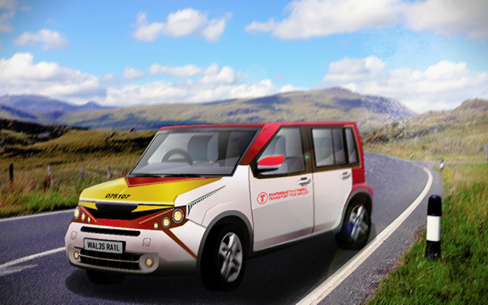 Electric vehicle with registration plate WALS3 RA1L on a rural road surrounded by hills under a partly cloudy sky. The car is white with red and yellow accents, displaying text on the side reading 'TRANSPORTATION TRANSFORM PROCEDURES' with a circular logo. Scene captures a modern used or new car concept in a scenic landscape.