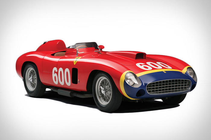Red vintage Ferrari race car with number 600 displayed prominently on the front and side, featuring a blue front grille area with yellow trim, classic wire-spoked wheels, and an open cockpit design, representing a classic model relevant to both used cars and new cars enthusiasts.