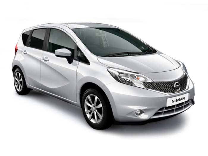 Silver Nissan hatchback car angled to show front and left side with clear Nissan badge on the front grille and a license plate reading 'NISSAN', isolated on a white background, suitable for advertising used cars and new cars.