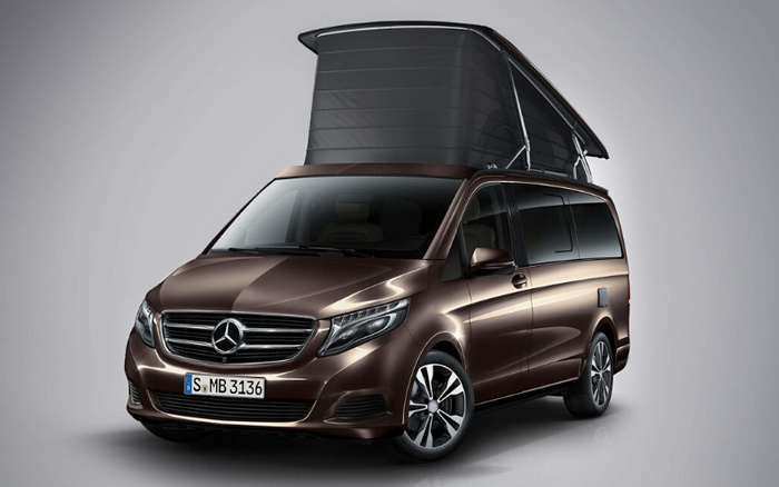 Brown Mercedes camper van with pop-up roof extended, front view showing German license plate S MB 3136, studio background, suitable for advertising used cars or new cars.